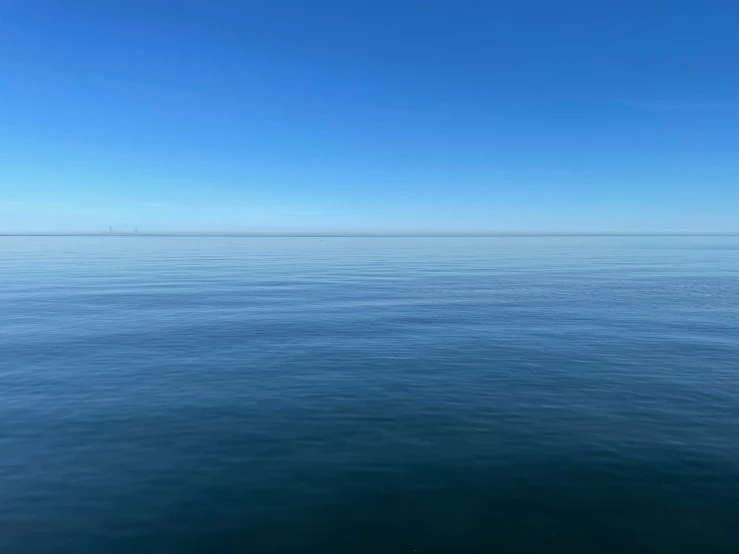 a large body of water with sky in the background