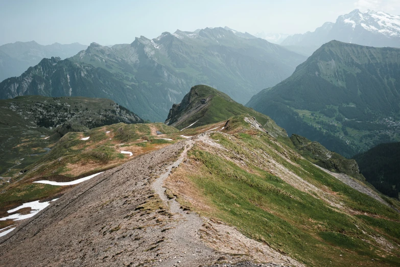 a view of some very big mountains and the road