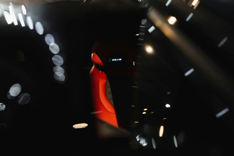 a car's dashboard at night from inside the vehicle