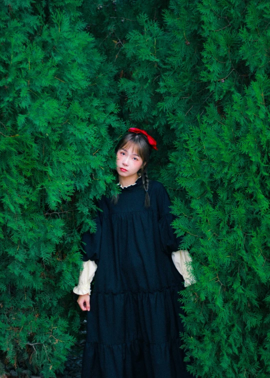 a little girl is standing in a field