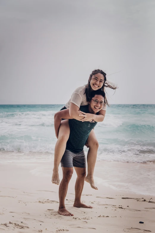 a man riding on the back of his girlfriend