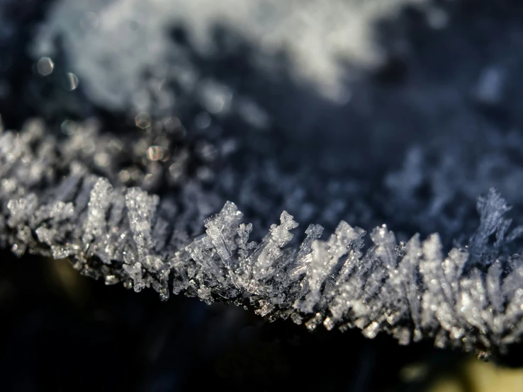 a snowflake that has been partially covered by winter