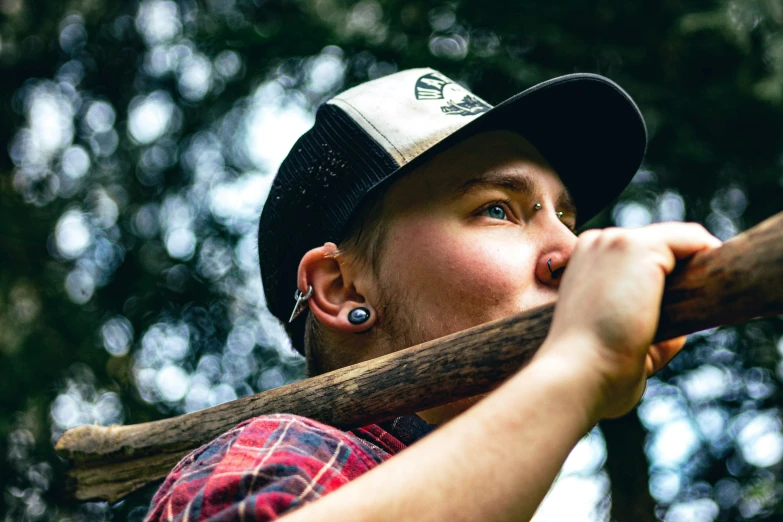 a young man swings his baseball bat toward the sky