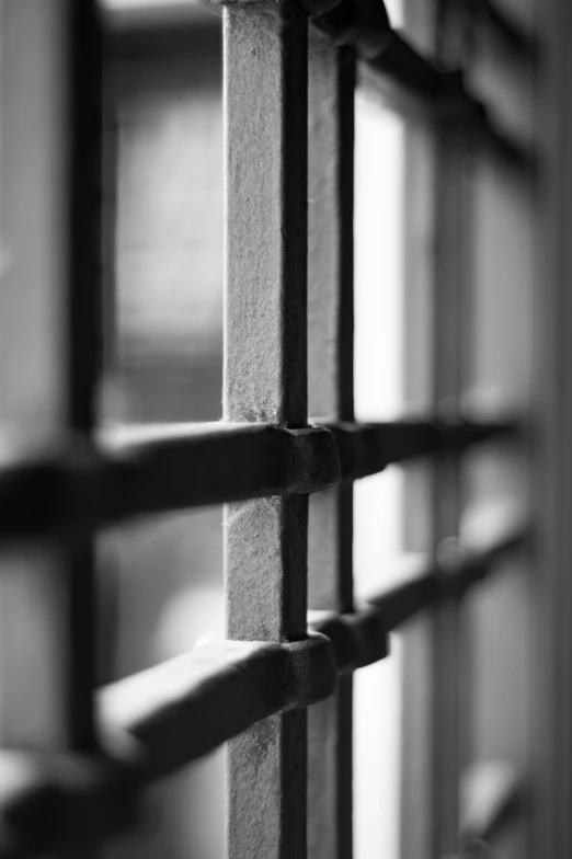 a black and white po of wooden slats on the outside wall