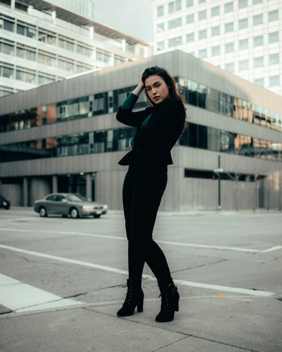 a girl is leaning against her back in a building