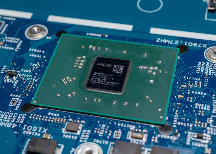 a processor chip sitting on top of a piece of printed circuit board