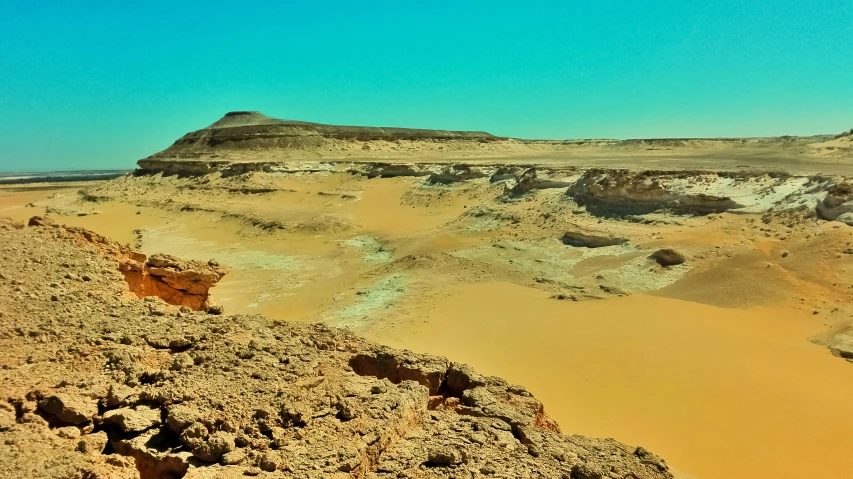 a mountain in the desert near a valley