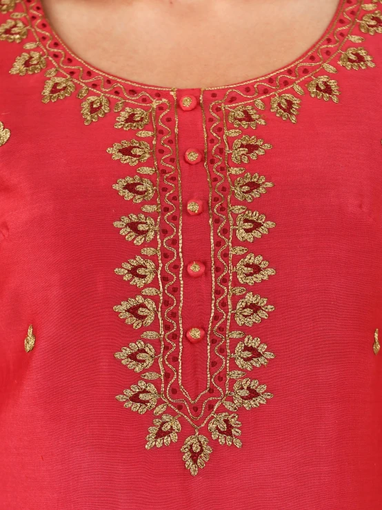 an embroidered blouse with beads and flowers on the back