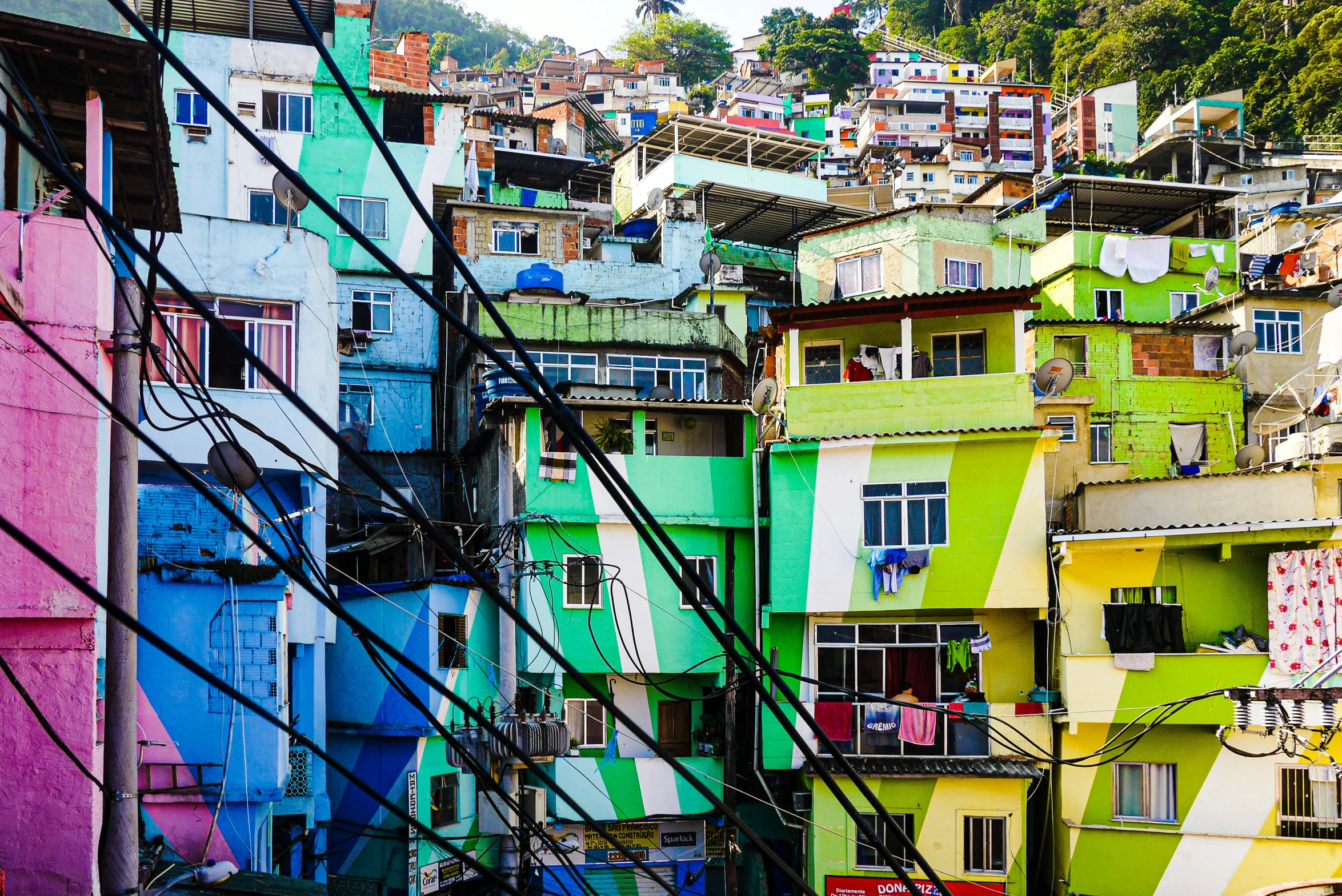 colorfully painted buildings line the hillside in a city