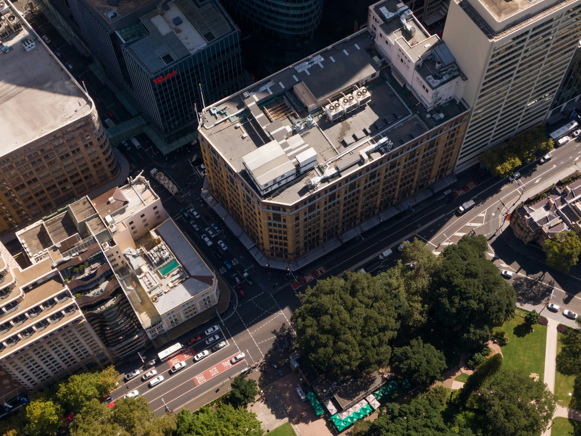 an aerial view of buildings and street in the city