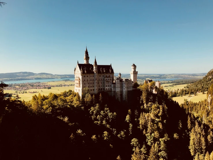 an image of a castle taken from a hill top