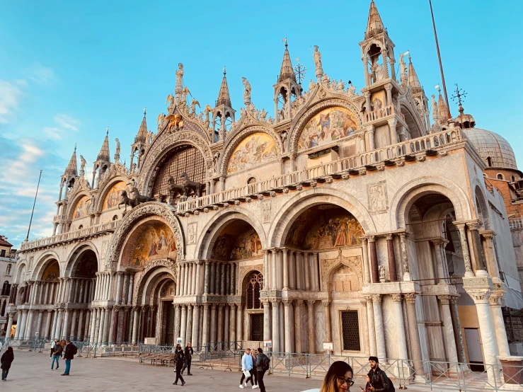 an old building in italy with stone arches and spires