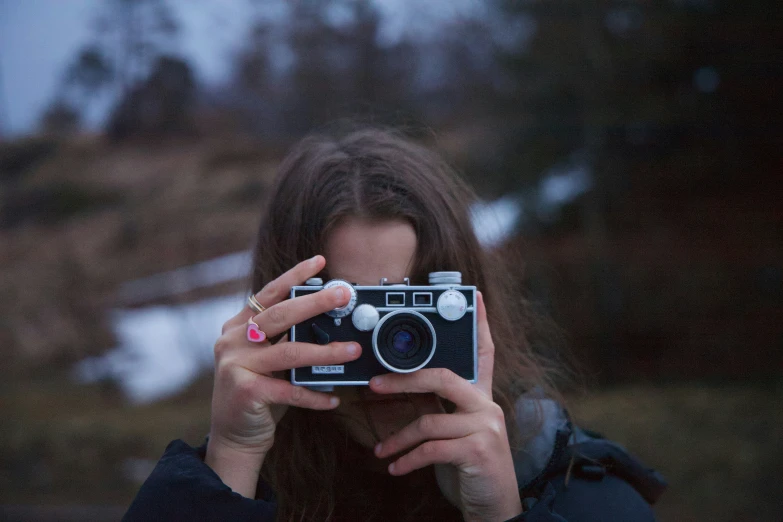 a woman taking a po with a camera