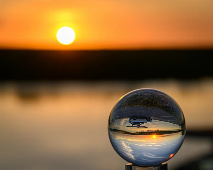 a small mirror ball is on a wood table