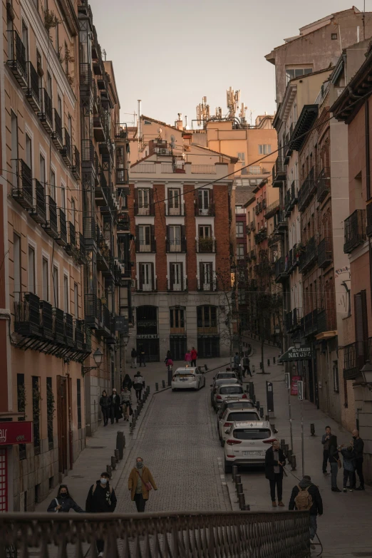 a street is full of parked cars on it