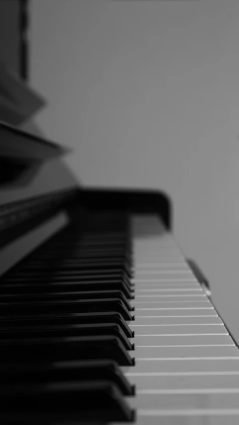 a black and white po of a piano