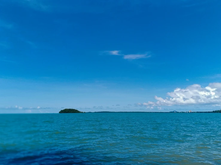 there are clouds that are very high in the sky above water