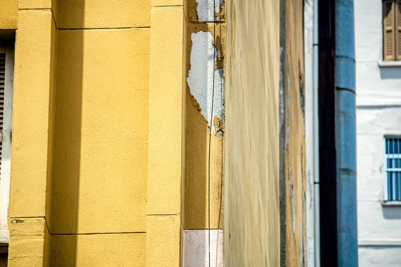 the corner of a building with a broken window