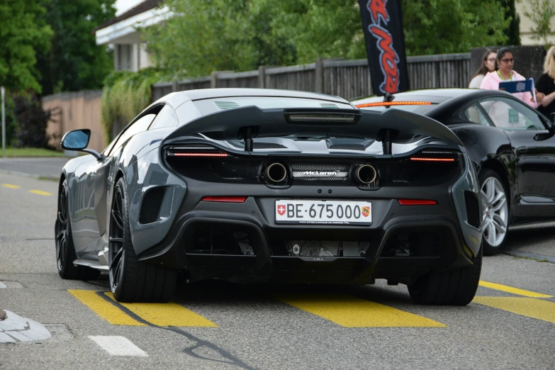 a car is parked outside the city by a curb