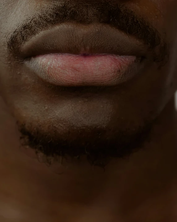 close up of an open mouth with shaving hair