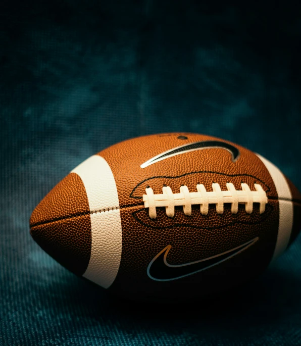 an american football on the black background