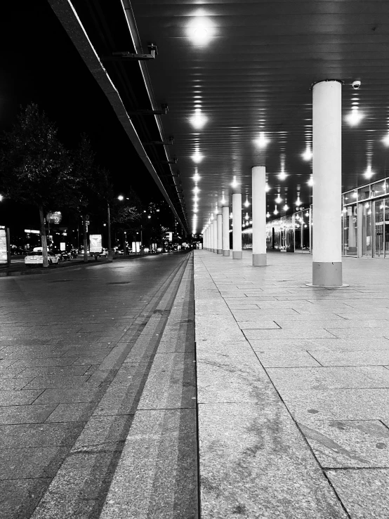 a deserted parking area next to an empty street