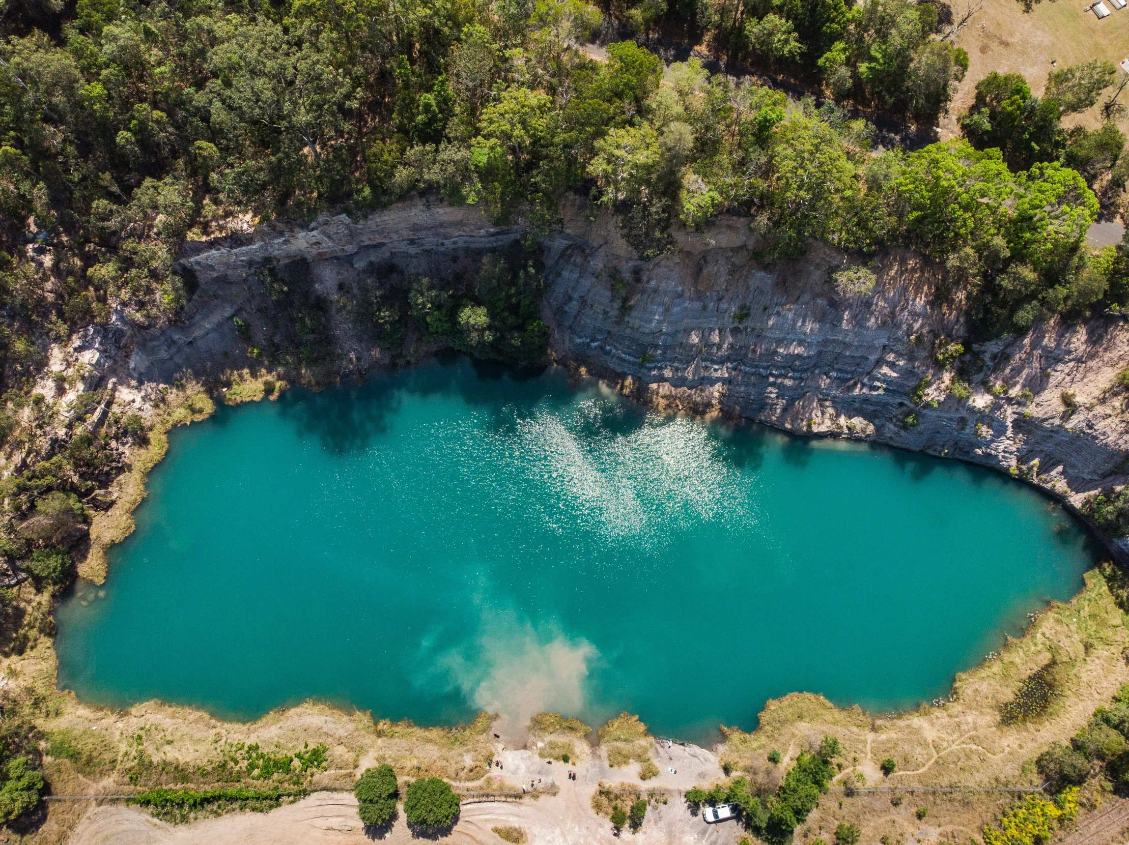 a blue lake sits in the middle of an area