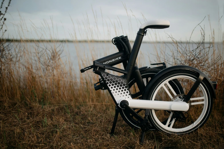 a folding bicycle parked near the sea shore