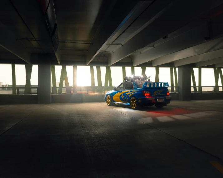 blue car in an empty parking space with bright light