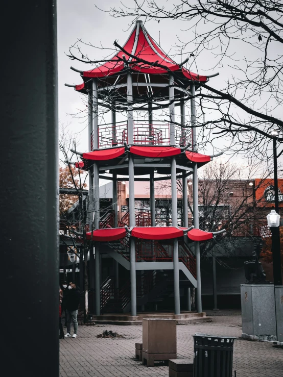 there is a tower that has red seats in it