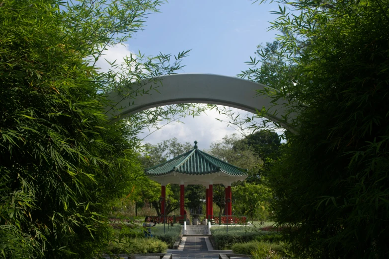 an open entrance into a lush green park