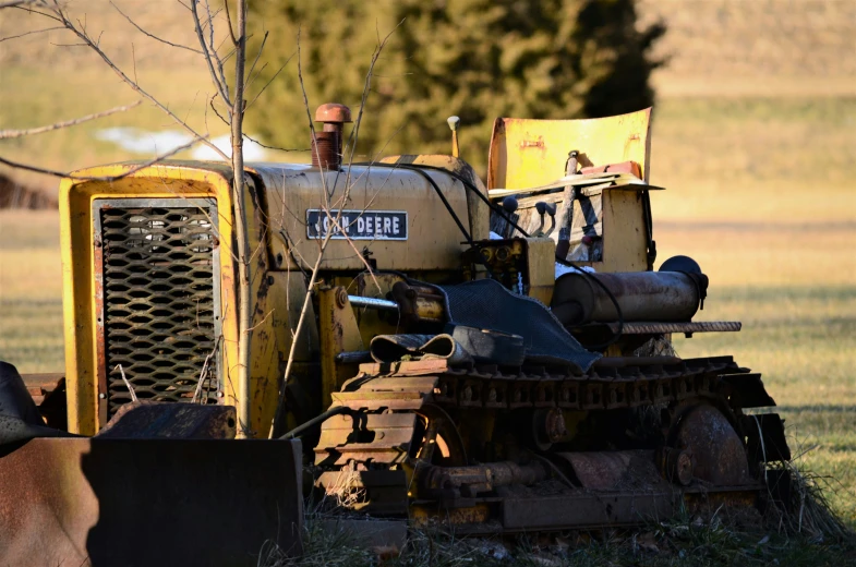 a tractor that is parked outside on some grass