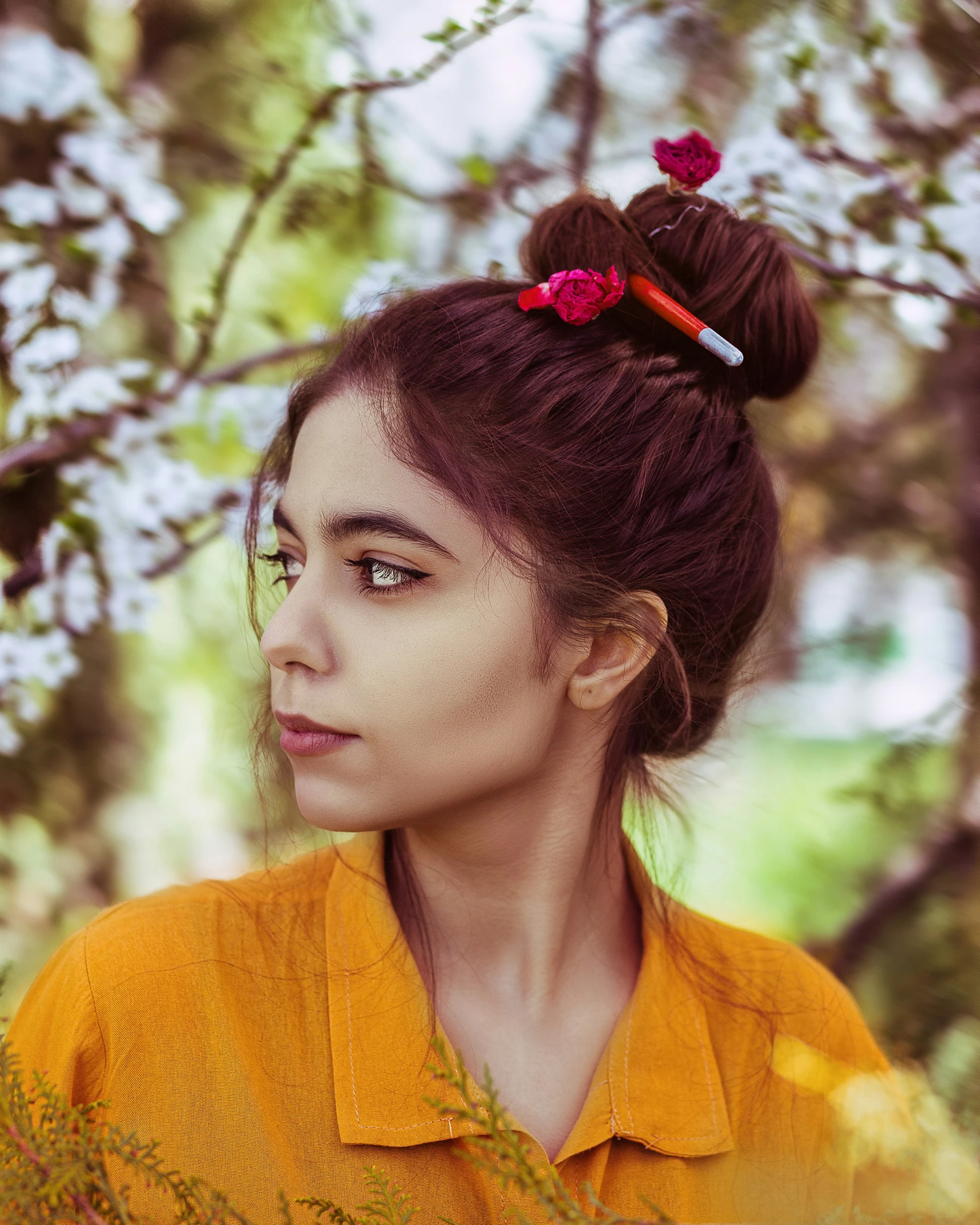 a woman with flowers tied to her hair