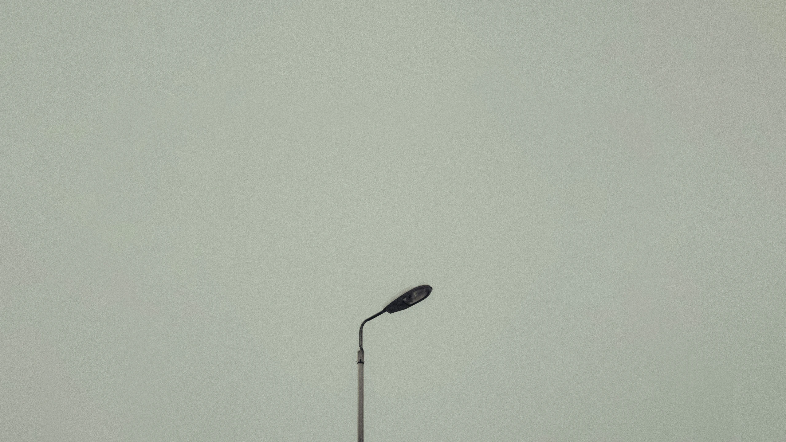 there is a street light with snow on it