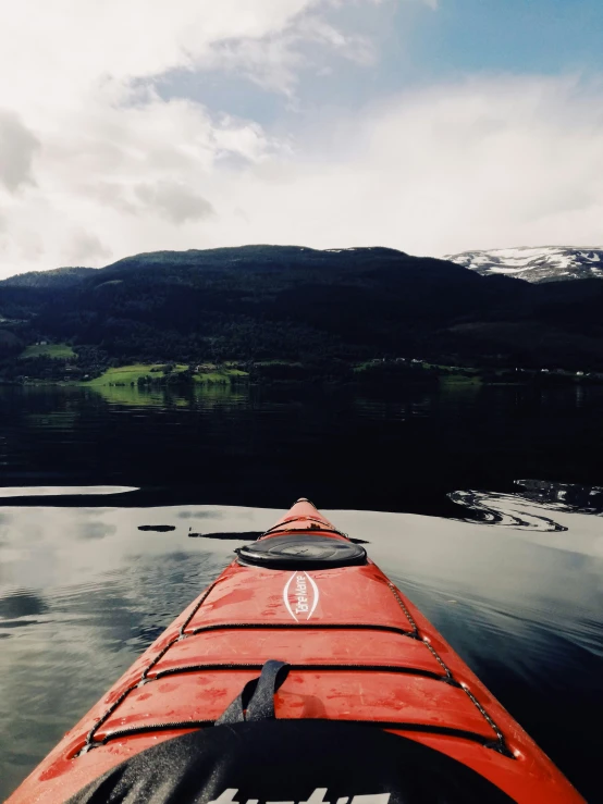 the view from inside the kayak looking down on mountains