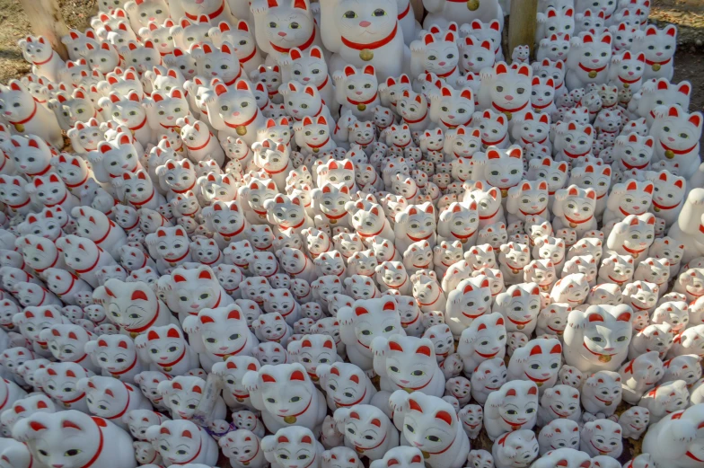 an outdoor display of many white and red teddy bears