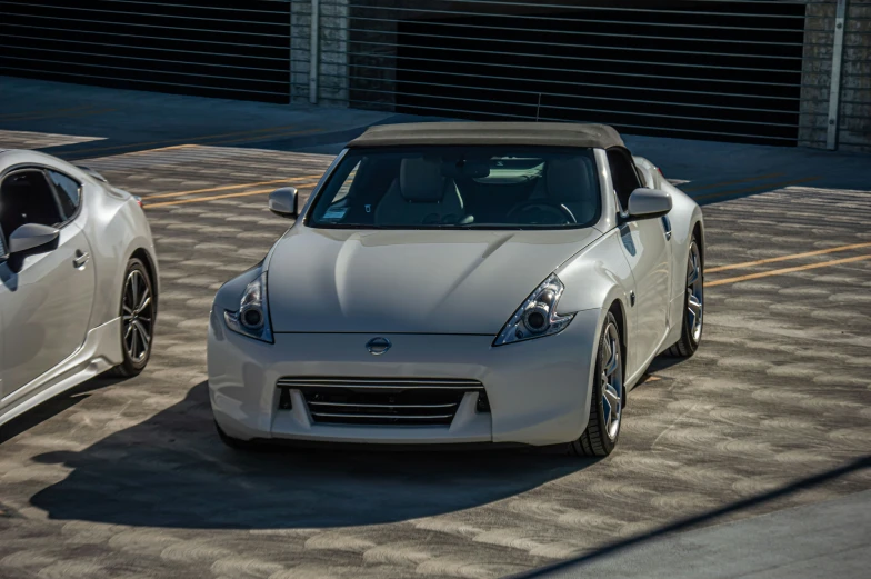 two sports cars are parked next to each other