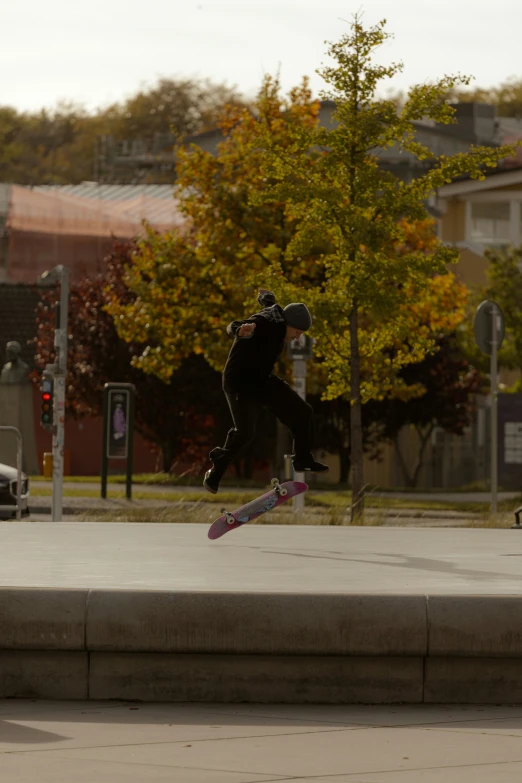 a young man does a skateboard trick in the air