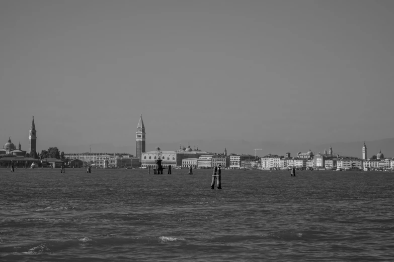 boats are sailing in the water near the city