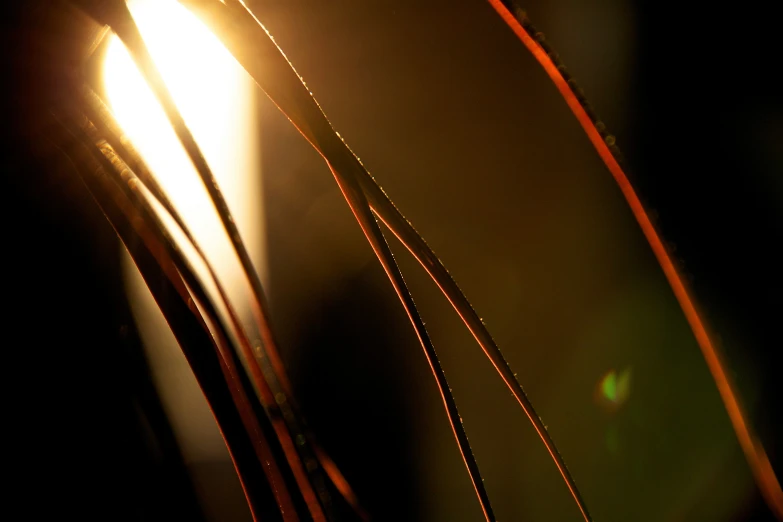 a close - up of two bright yellow light streaks on a black background