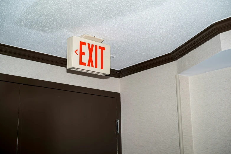 a light box on the ceiling of an exit area