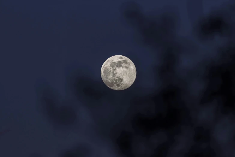 the moon can be seen overcast skies during the day