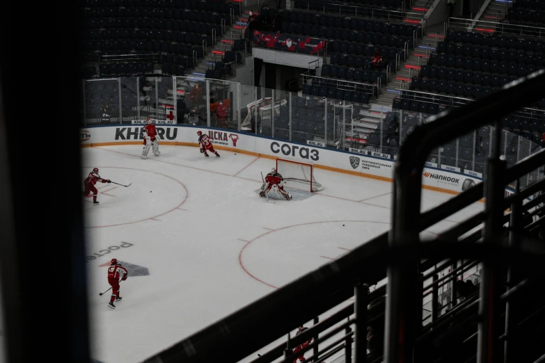 a group of people standing on top of a hockey rink