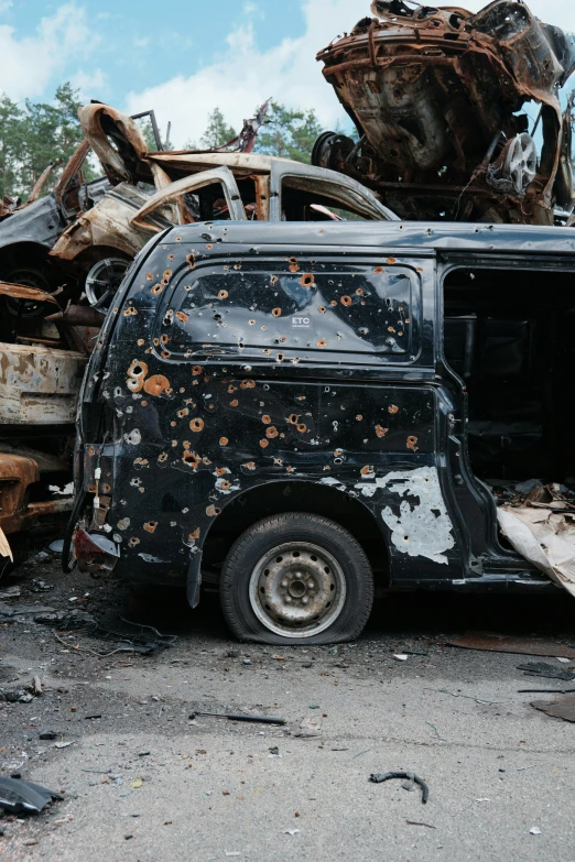 the car in the parking lot is filled with junk