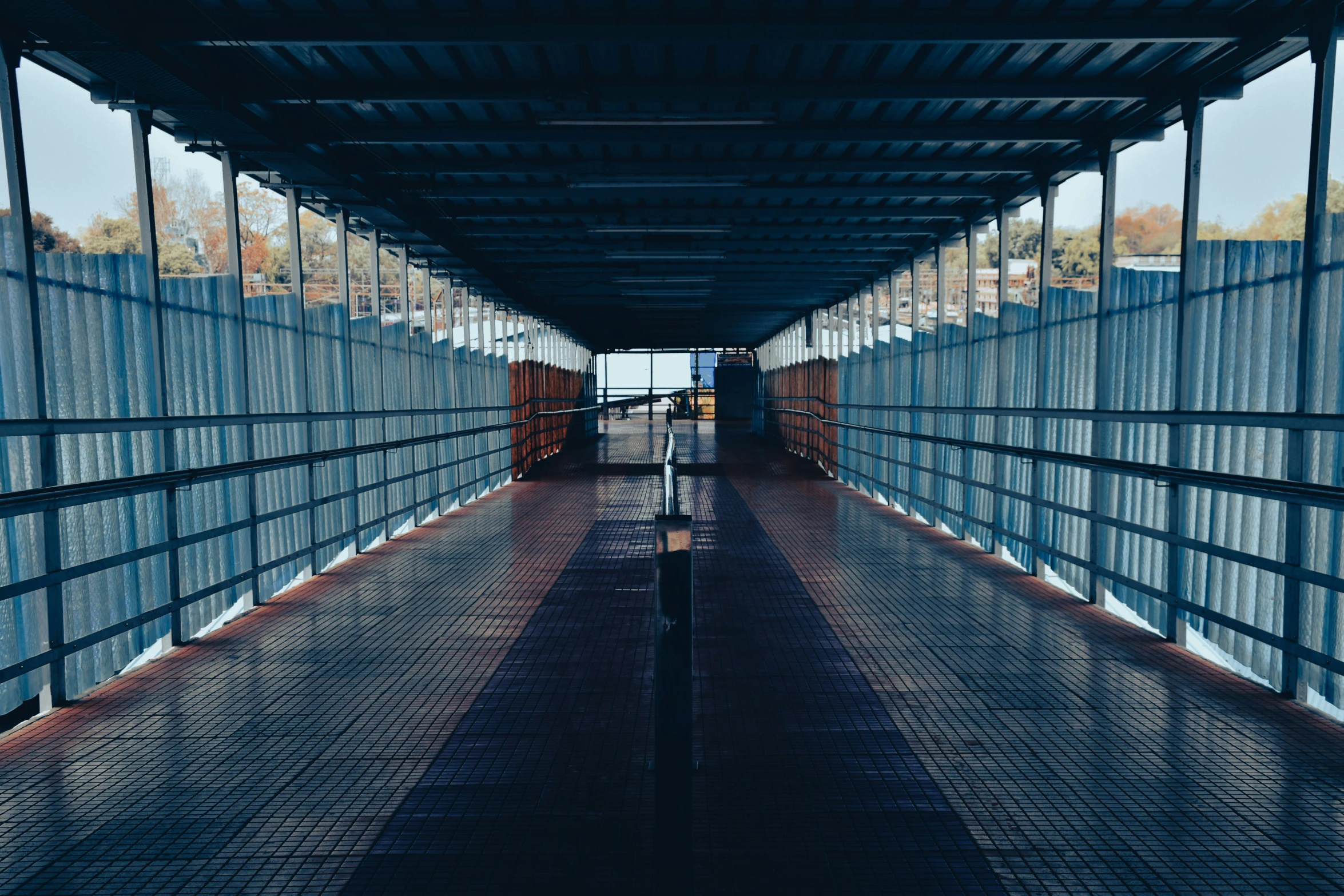 an empty walkway that runs in between two buildings