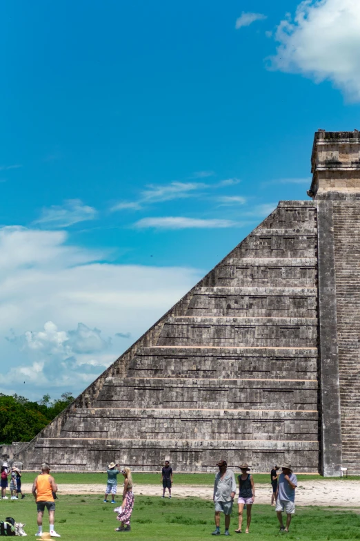 tourists in front of pyramid at chichen