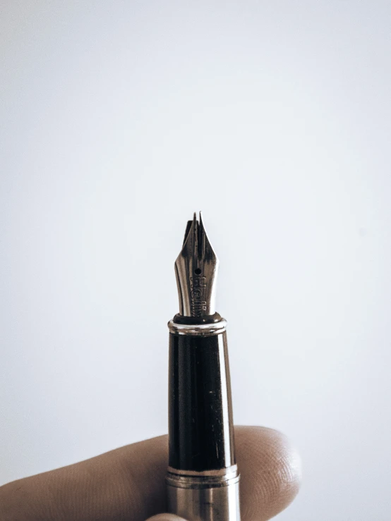 an old type of pen on the table