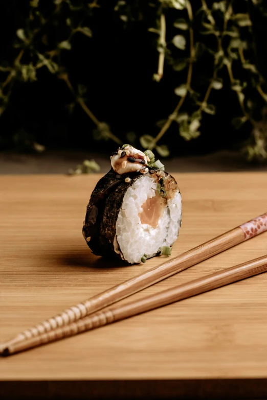 a sushi and chopsticks on a table