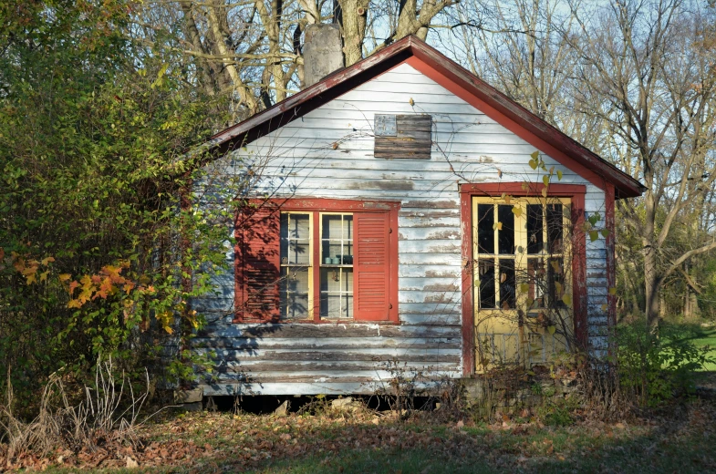 the small house with the windows is painted red