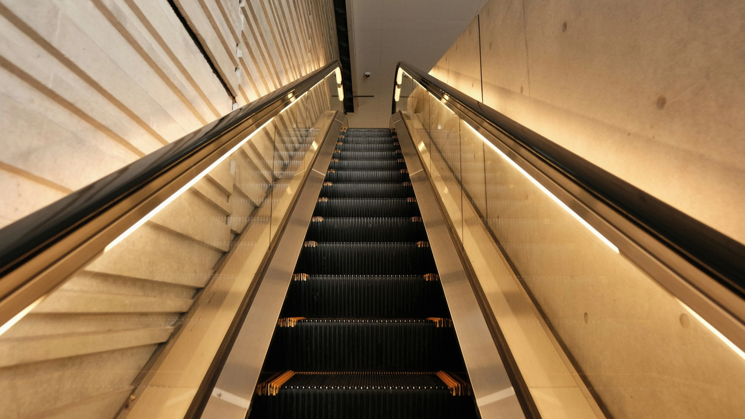 escalator on the upper half of an airplane in a subway station